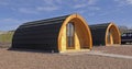 Wooden Glamping pod in a glamping village with yurts and gravel paths Ireland