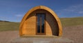 Wooden Glamping pod in a glamping village with yurts and gravel paths Ireland