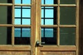 The wooden and glass door of a house on the sea coast