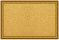 Wooden and gold gilded ornamental frame with rectangular beige cork board Royalty Free Stock Photo