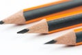 Wooden graphite pencils above white background with copy space