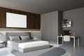 Wooden and gray bedroom with home office