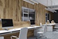 Wooden and gray office corner, computer screen