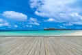 Wooden gray pier on perfect beach in sunny day with blue sky