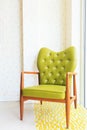 Wooden green arm chairs in living room