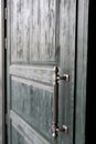 Wooden green door with metal handle Royalty Free Stock Photo