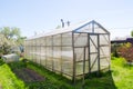 Wooden greenhouse with polycarbonate in the garden Royalty Free Stock Photo