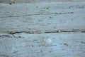 Wooden grey faded logs background with flaws and splits