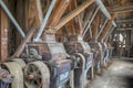 Wooden grist mill equipment in abandoned factory Royalty Free Stock Photo