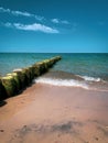 A Wooden groynes lead as breakwaters into the Baltic Sea