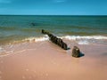 A Wooden groynes lead as breakwaters into the Baltic Sea