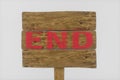 Wooden guide board with `end` word on it, 3d rendering