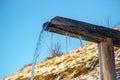 Wooden gutter with spring water