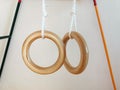 Wooden gymnastic rings at the children`s sports complex in the apartment