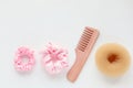 Wooden Hairbrush, barrette and Pink Scrunchy isolated on white. Flat lay Hairdressing tools and accessoriesas Color Hair Royalty Free Stock Photo