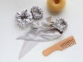 Wooden Hairbrush, barrette and silk Scrunchy isolated on white. Flat lay Hairdressing tools and accessoriesas Color Hair Royalty Free Stock Photo