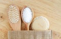 Wooden hairbrush, bath salts, soap bar and loofah sponge. Natural beauty treatment, skip-care or zero waste concept. Top view Royalty Free Stock Photo