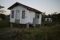 Wooden hand build house on bricks