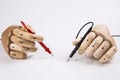 Wooden Hand and electric multimeter Royalty Free Stock Photo