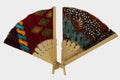 A wooden hand fan in Javanese cloth called batik