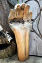 Wooden hand like sculpure in Cadore in Dolomity mountains, Italy