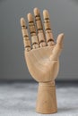 The wooden hand shows a gesture of openness. The concept of communication