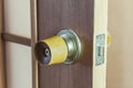 Wooden handle with metal lock for interior doors. Outdated fittings Royalty Free Stock Photo