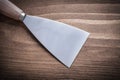 Wooden handled putty spattle close up Royalty Free Stock Photo