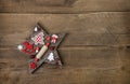 Wooden handmade carved star with red and white christmas decorat Royalty Free Stock Photo