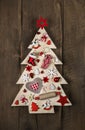 Wooden handmade christmas tree with white and red decoration. Royalty Free Stock Photo