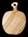 Wooden handmade kitchen board carved in the shape of an apple isolated