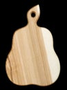 Wooden handmade kitchen board carved in the shape of an pear isolated