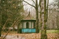 A wooden handmade old gazebo floats on a river. Sunset by the lake. A house on the water. A place for barbecue on the Royalty Free Stock Photo