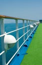 Wooden handrail on cruise ship deck at sea
