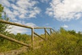 Wooden handrail of the natural walkway, directed upward, Newbold Quarry Park, UK