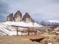 Wooden handrail and sign on trekking path at Dolomites mountains Royalty Free Stock Photo