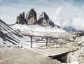 Wooden handrail and sign on trekking path at Dolomites mountains Royalty Free Stock Photo