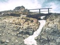 Wooden handrail and sign on trekking path at Dolomites mountains Royalty Free Stock Photo