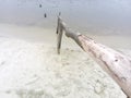 Wooden handrails on the beach. An improvised beach on the lake