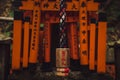 Wooden hanging decoration with Japanese writings and the gates of Thousands Torii Gate shinto shrine