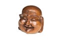 Wooden happy Buddha head statue. Souvenir from Indonesia, Southeast Asia. White background. Royalty Free Stock Photo