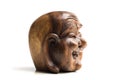 Wooden happy Buddha head statue. Souvenir from Indonesia, Southeast Asia. White background. Royalty Free Stock Photo