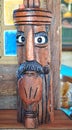 Wooden head with a pipe