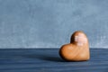 Wooden heart with adhesive plasters on table Royalty Free Stock Photo