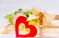 Wooden heart with a bow on a bench on a white background. Valentines Day. concept of love, romantic decor.