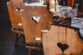 A wooden heart, a heart carved in the back of a chair, a heart on furniture, a hole in the shape of a heart