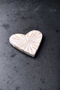 Wooden Heart on dark stone background. Soft focus. Royalty Free Stock Photo