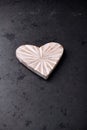 Wooden Heart on dark stone background. Soft focus. Royalty Free Stock Photo