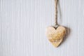 Wooden heart hanging on a light blue background Royalty Free Stock Photo