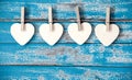 Wooden heart hanging on vintage blue wood background Royalty Free Stock Photo